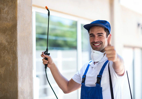 Certified pest control technician applying treatment in a residential property in Qatar